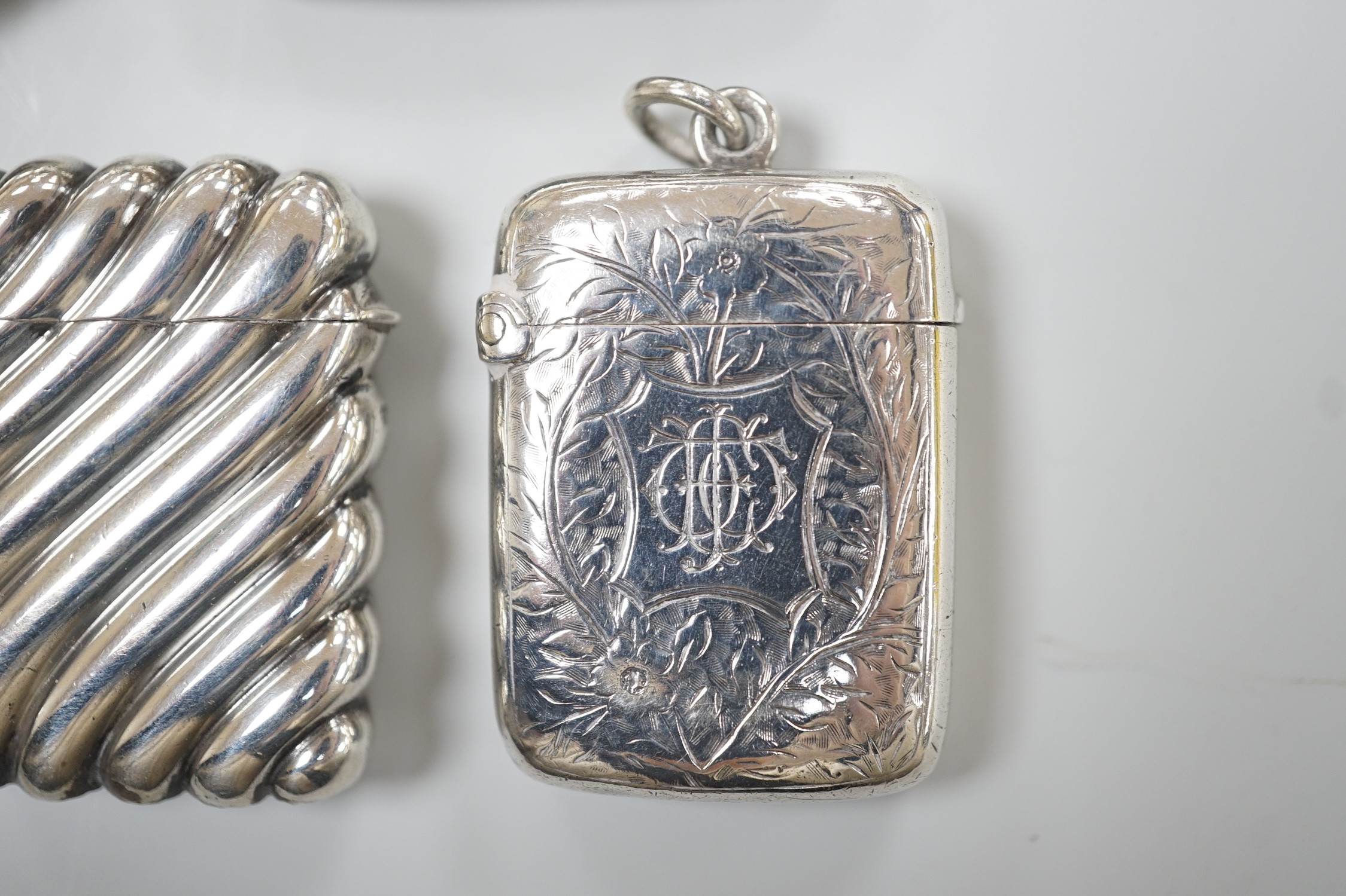 Five assorted late Victorian/Edwardian silver vesta cases, largest 46mm.